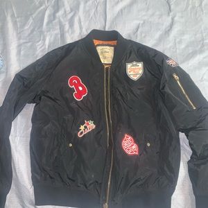 Size L jacket with patches gently used